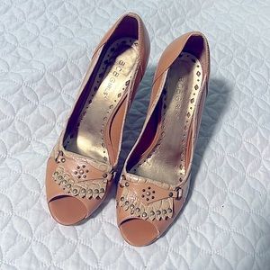 BCBGGIRLS: 1 pair of heels, tan, British, & golden color.